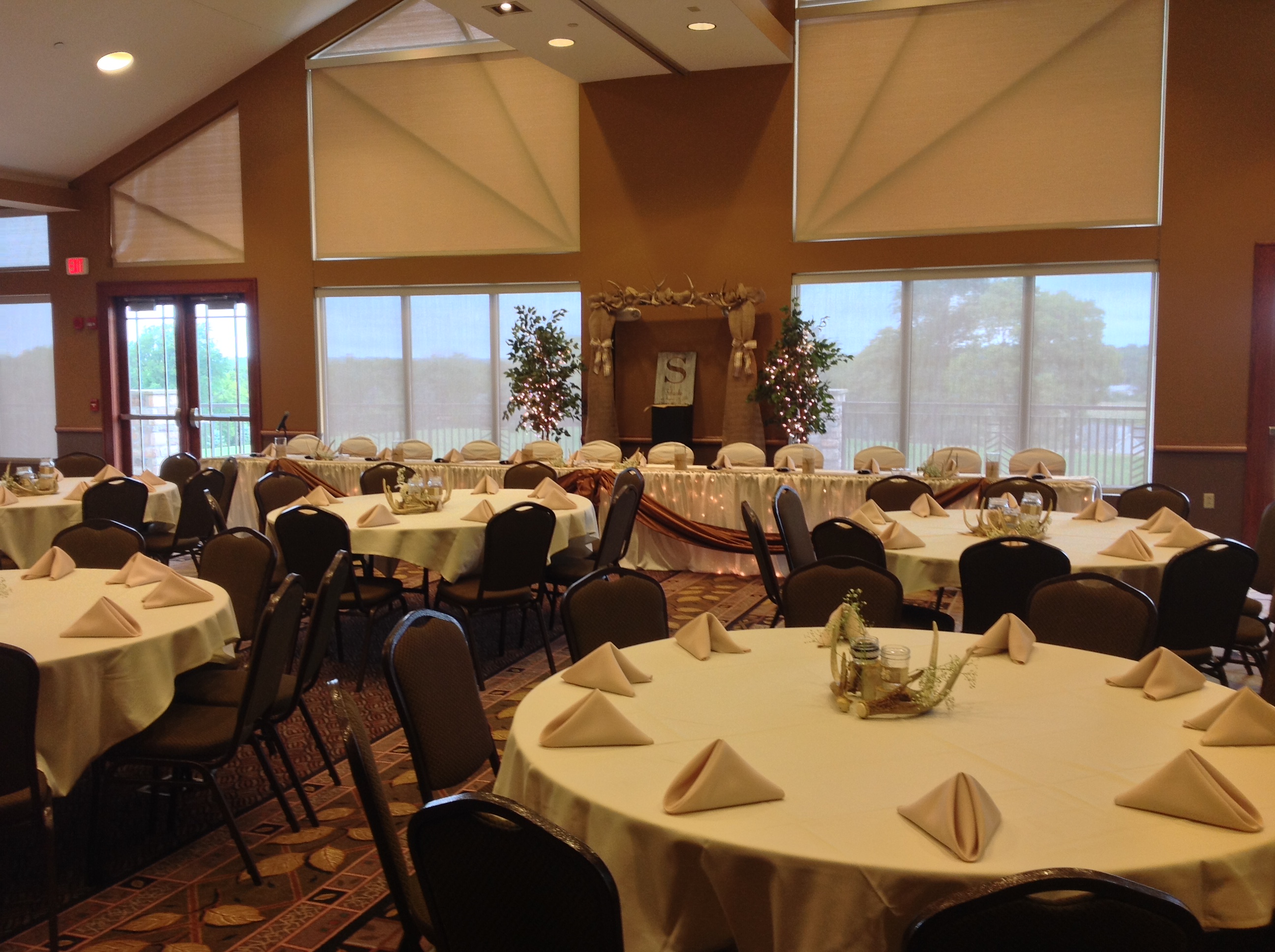 Wide view of wedding reception tables and head table