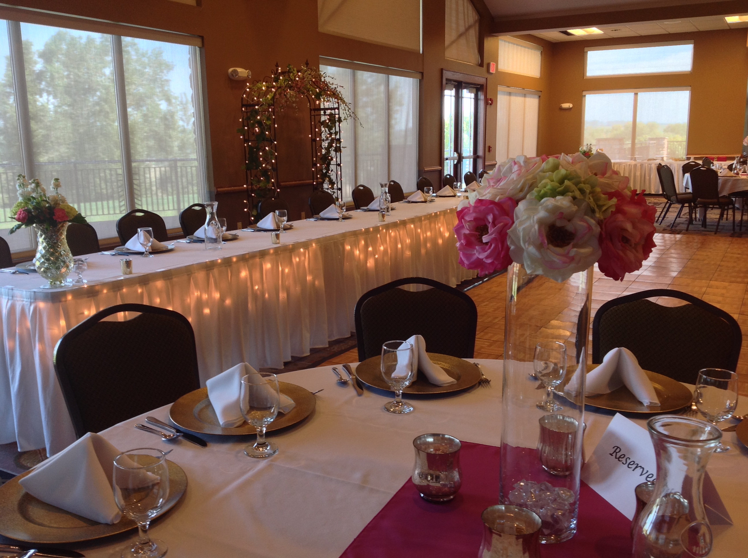 Flower table setting and decorated head table at Boulders Event Center